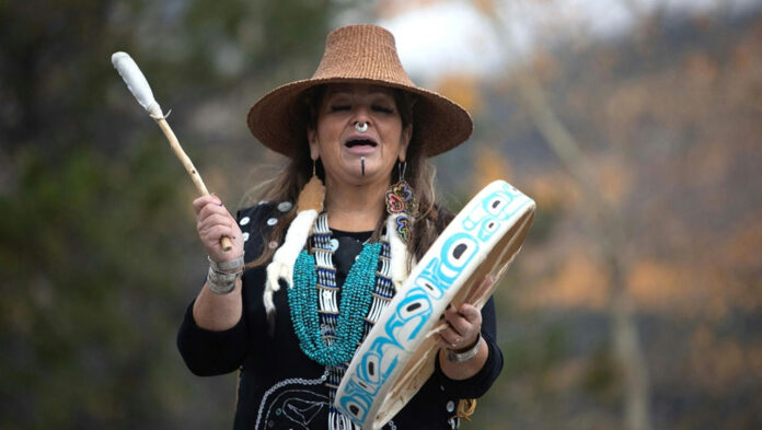 A woman participating in traditional indigenous ceremonies courtesy of the Government of Canada