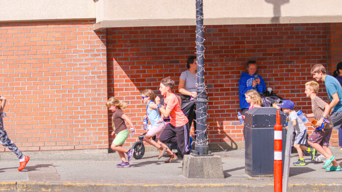 A group of kids taking part in the Terry Fox run starting at Northern Savings Credit Union