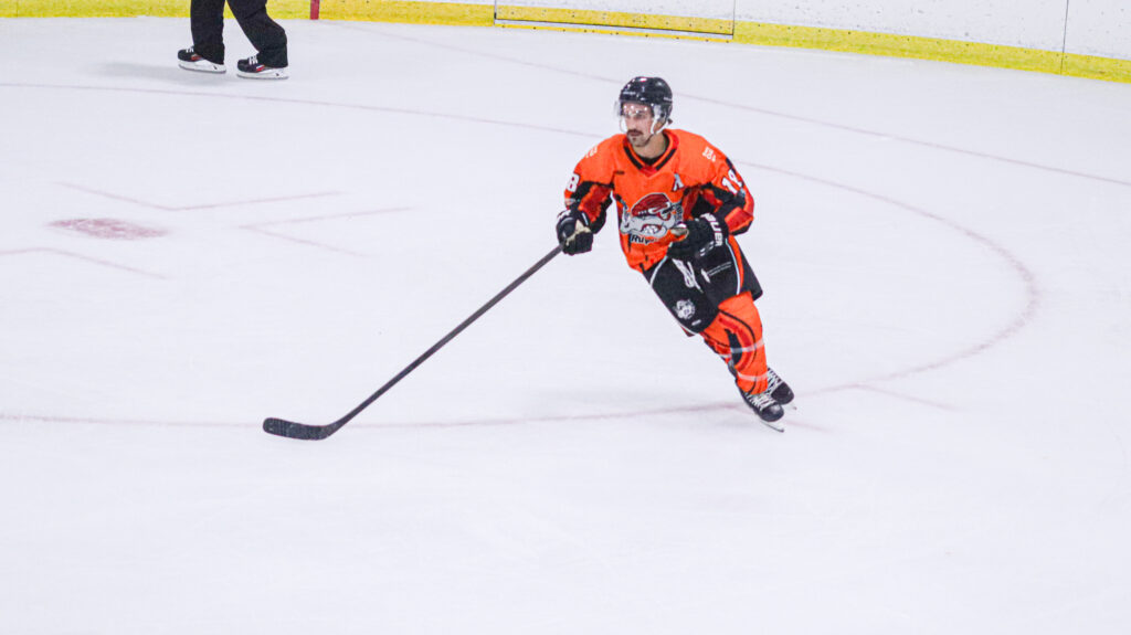 Rampage forward Judd Repole skating towards the puck