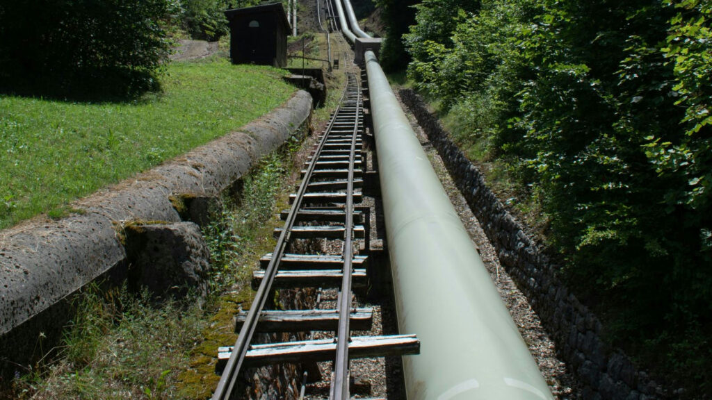 Pipeline construction on a mountainside. Photo by Nolan Krattinger on Unsplash